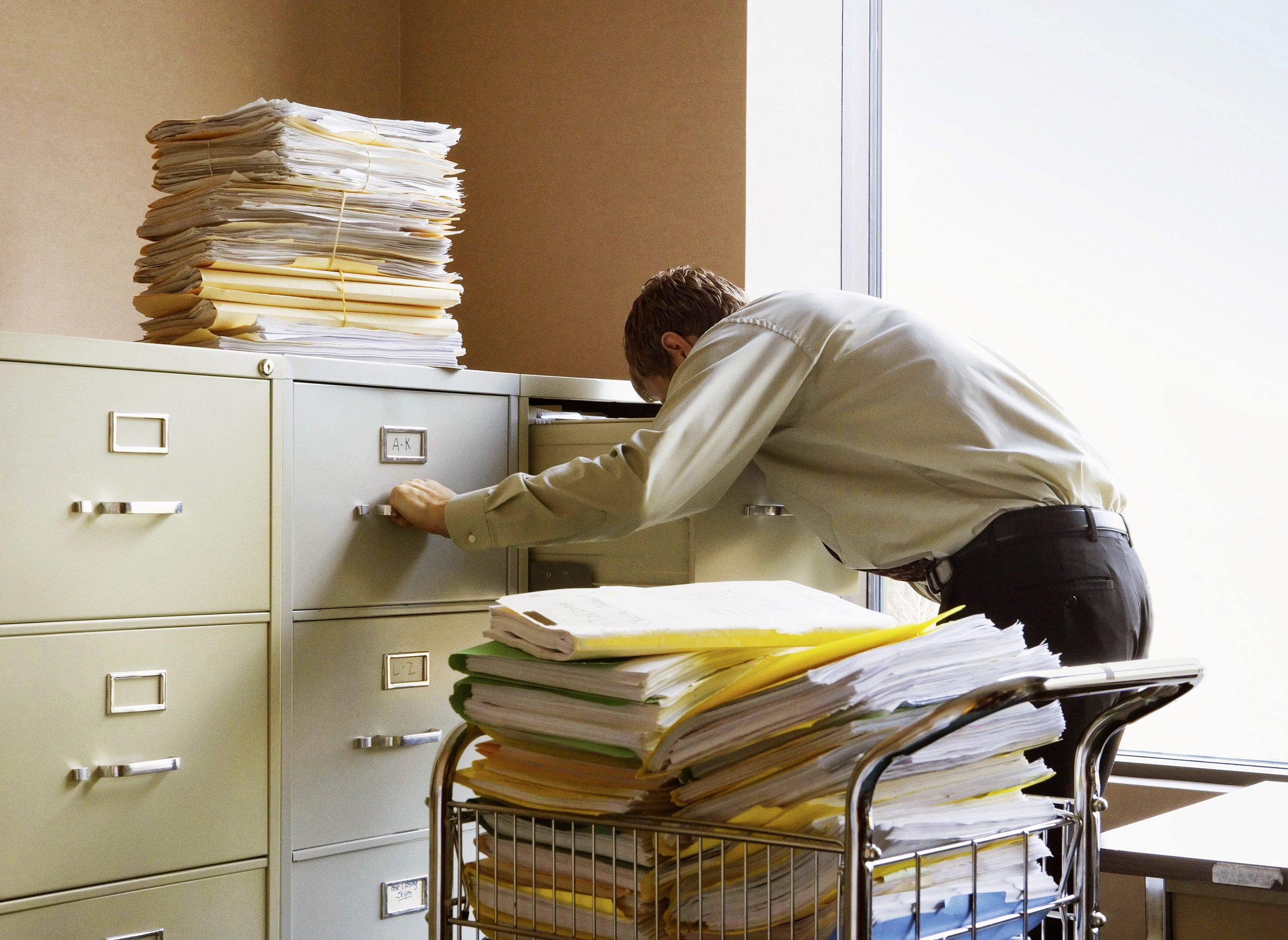 man in the office try to pull files