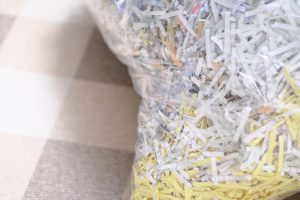 shredding paper confidential information