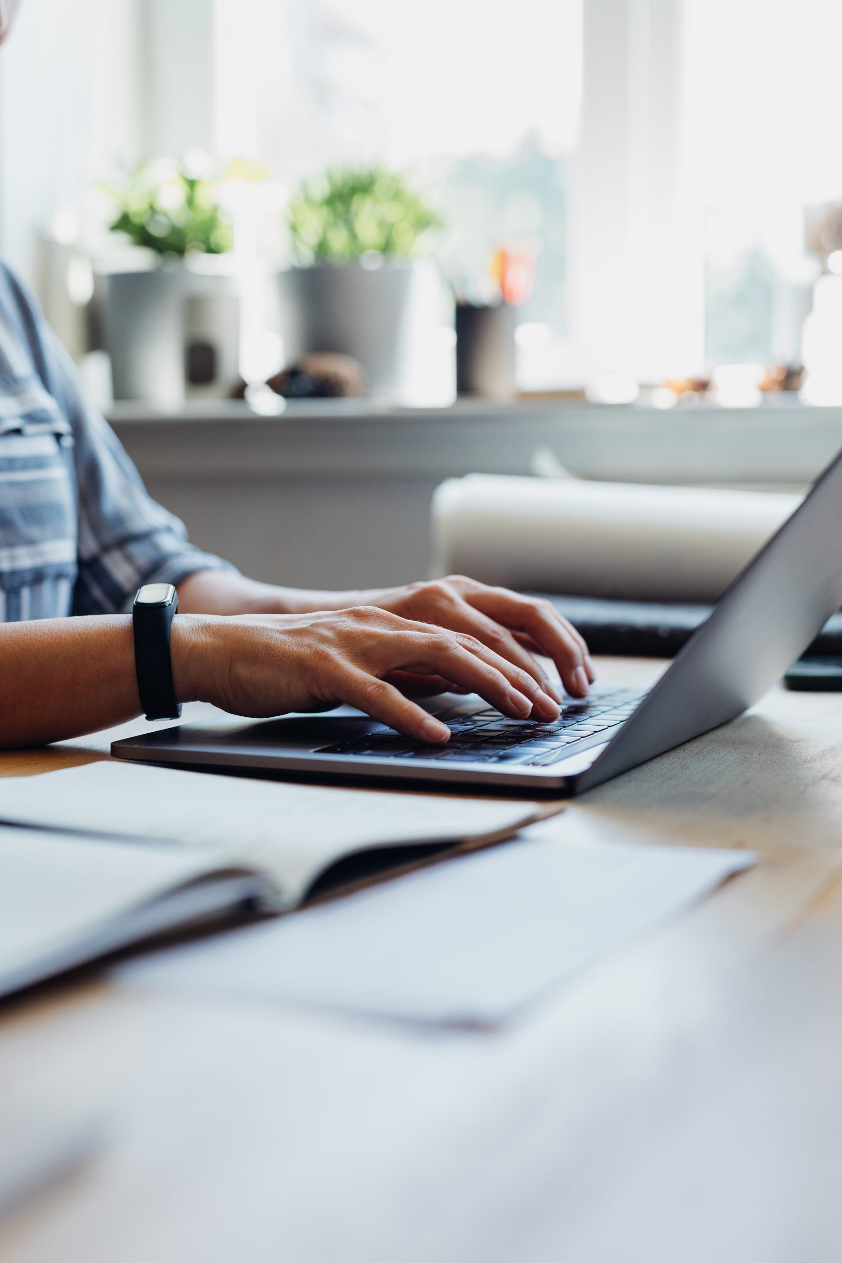 person working from home and securely shredding