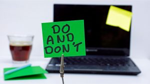 A note that is in front of a laptop that says "Do and Don't"