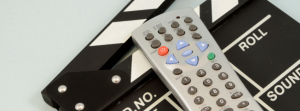 a remote on top of a entertainment device.