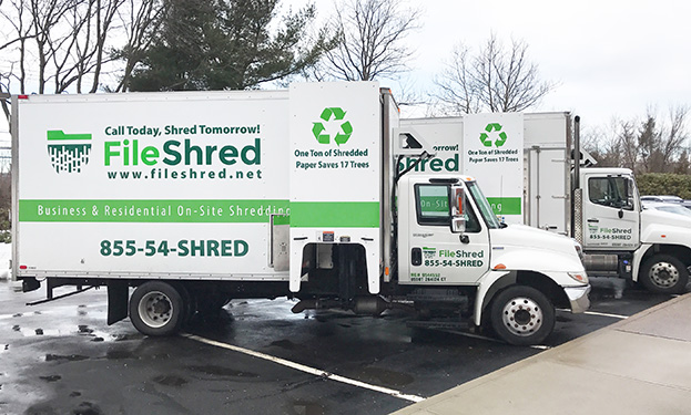 Tow FileShred mobile shredding trucks parked in a lot