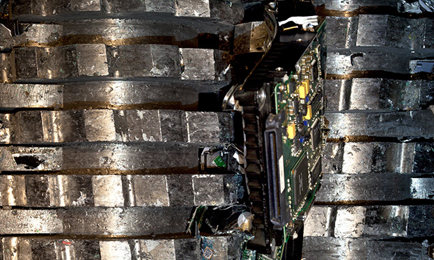 A hard drive being shredded in a shredder