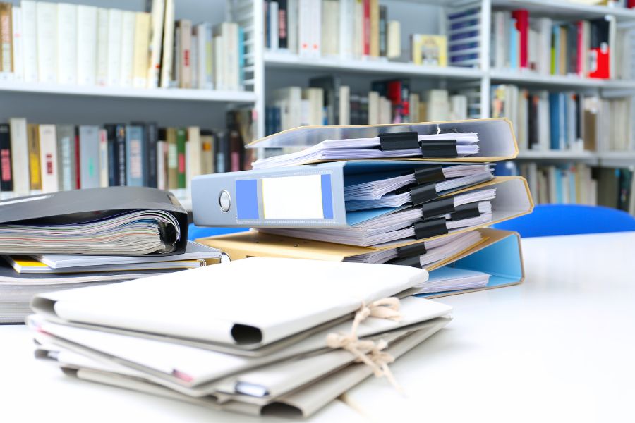 pile of documents on a desk