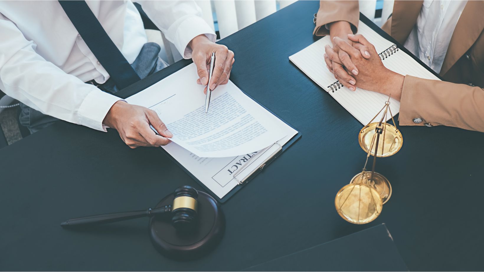 A lawyer talking to his client about information on documents