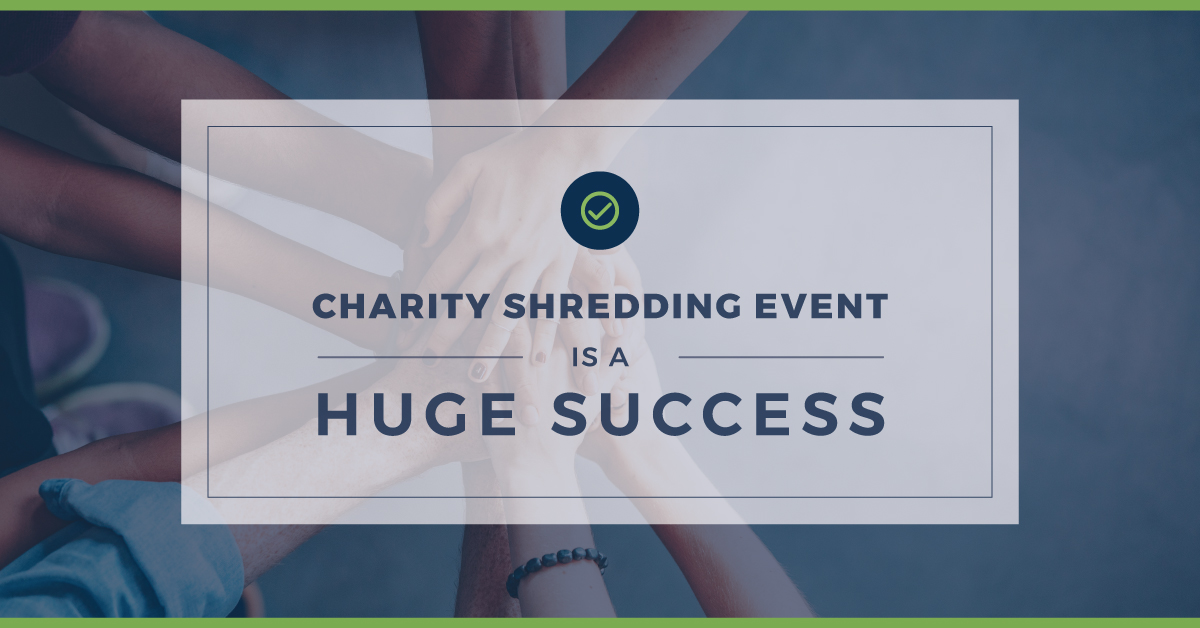 Charity Shredding Event is a Huge Success 10 people standing with their hands together in a circle