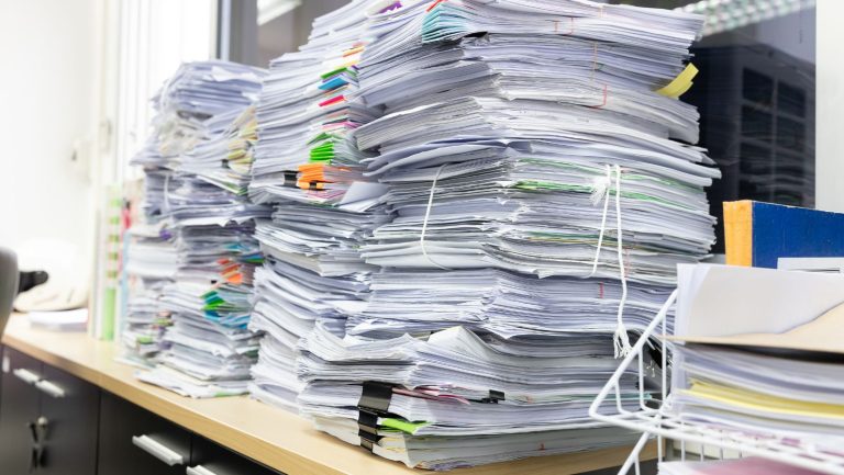 A stack of documents for an office cleanout